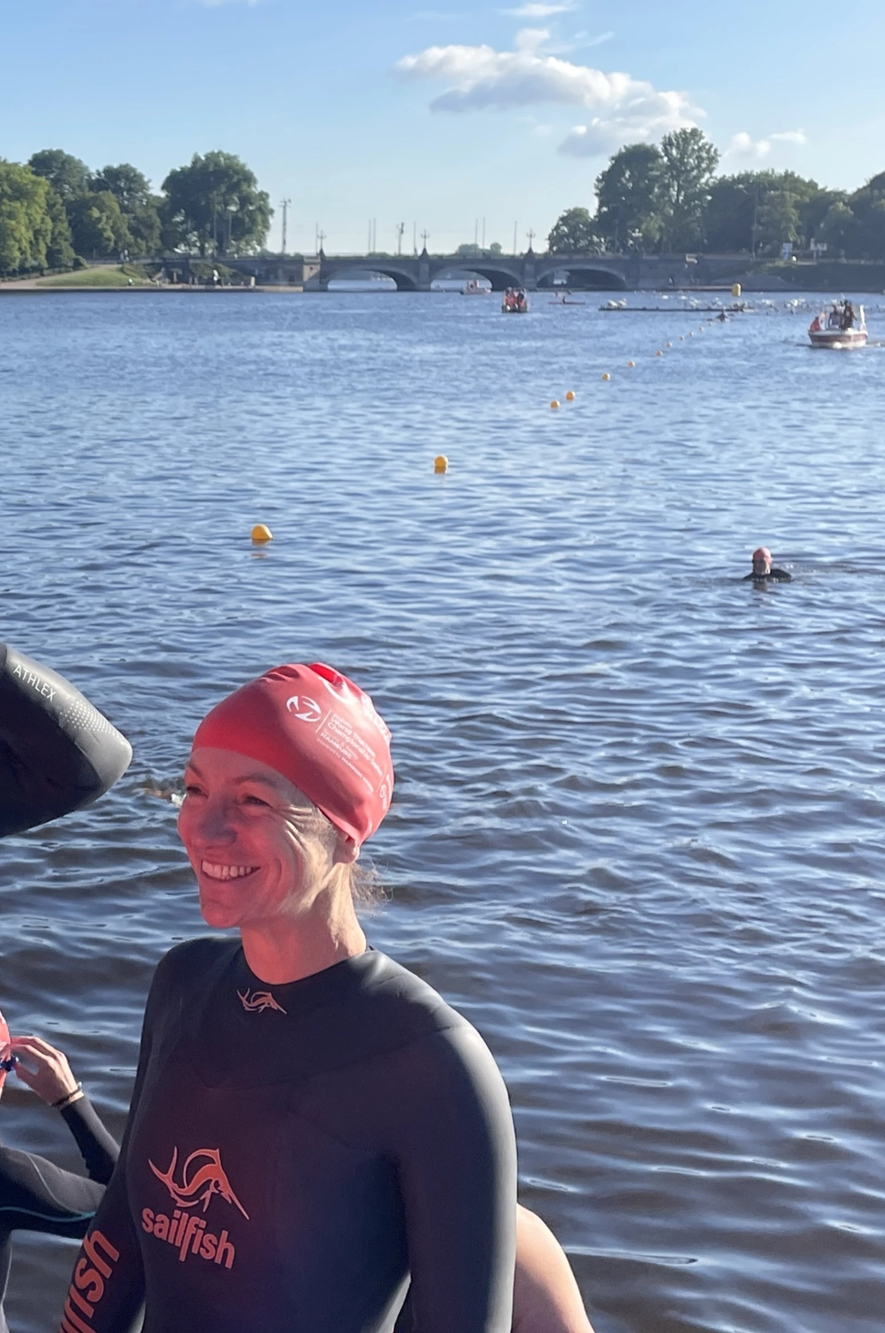 42.195 for Children - a global running initiative - a moment at an open water swimming event, likely a race or organized group swim.